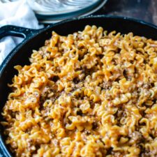 cast iron pan of homemade hamburger helper lasagna