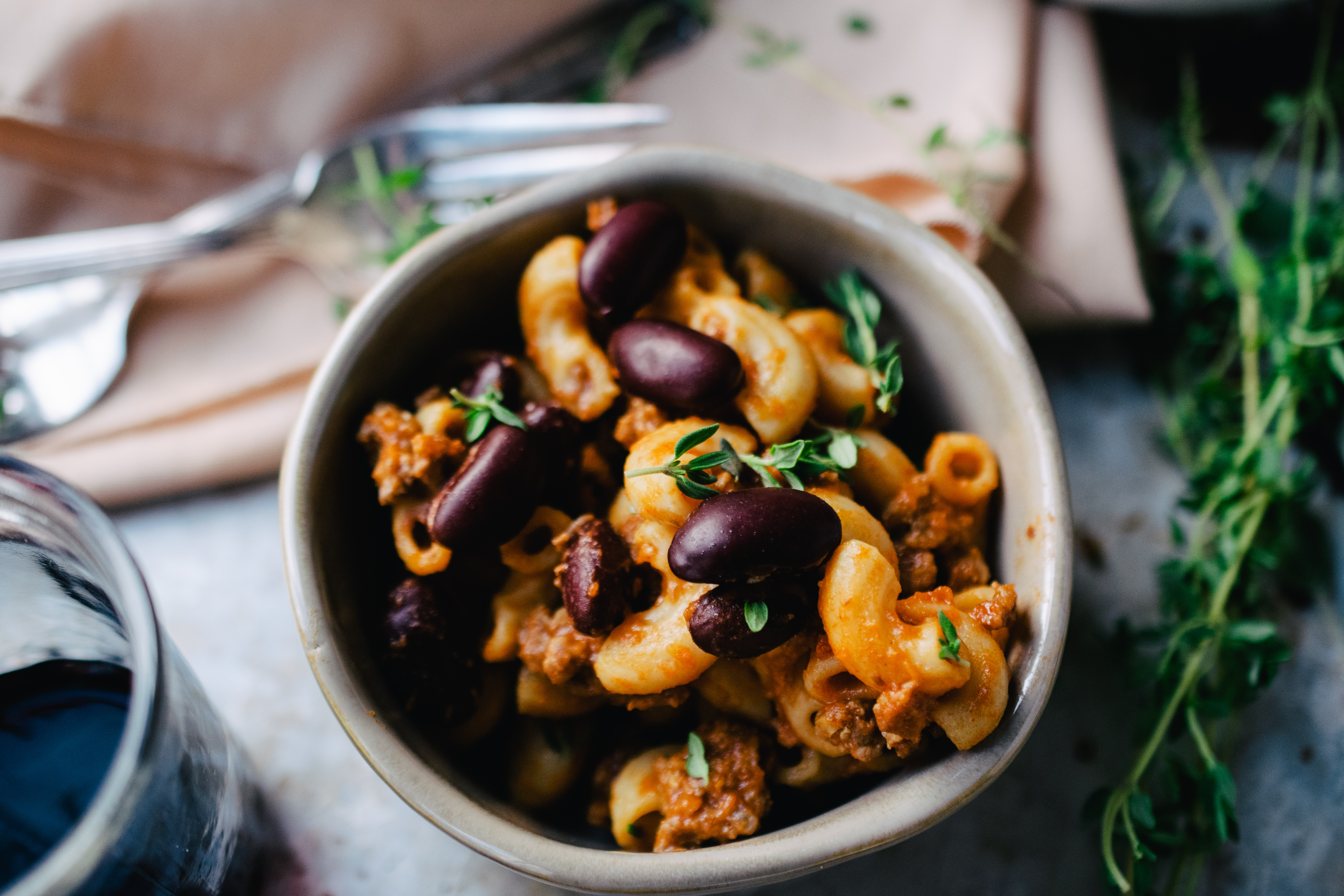 A bowl of goulash with ground beef and kidney beans