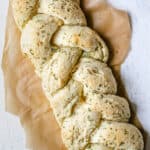 large, braided garlic bread with melted herb butter
