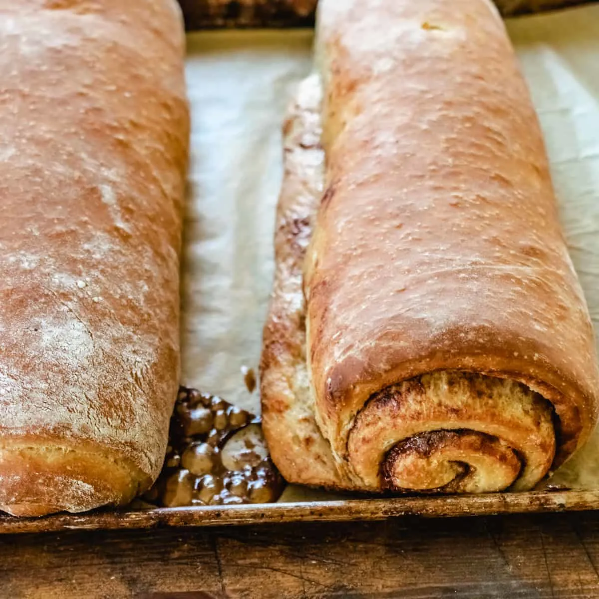 Two loaves of cinnamon bread swirled with cinnamon. 