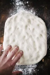 dough being pressed by finger tips