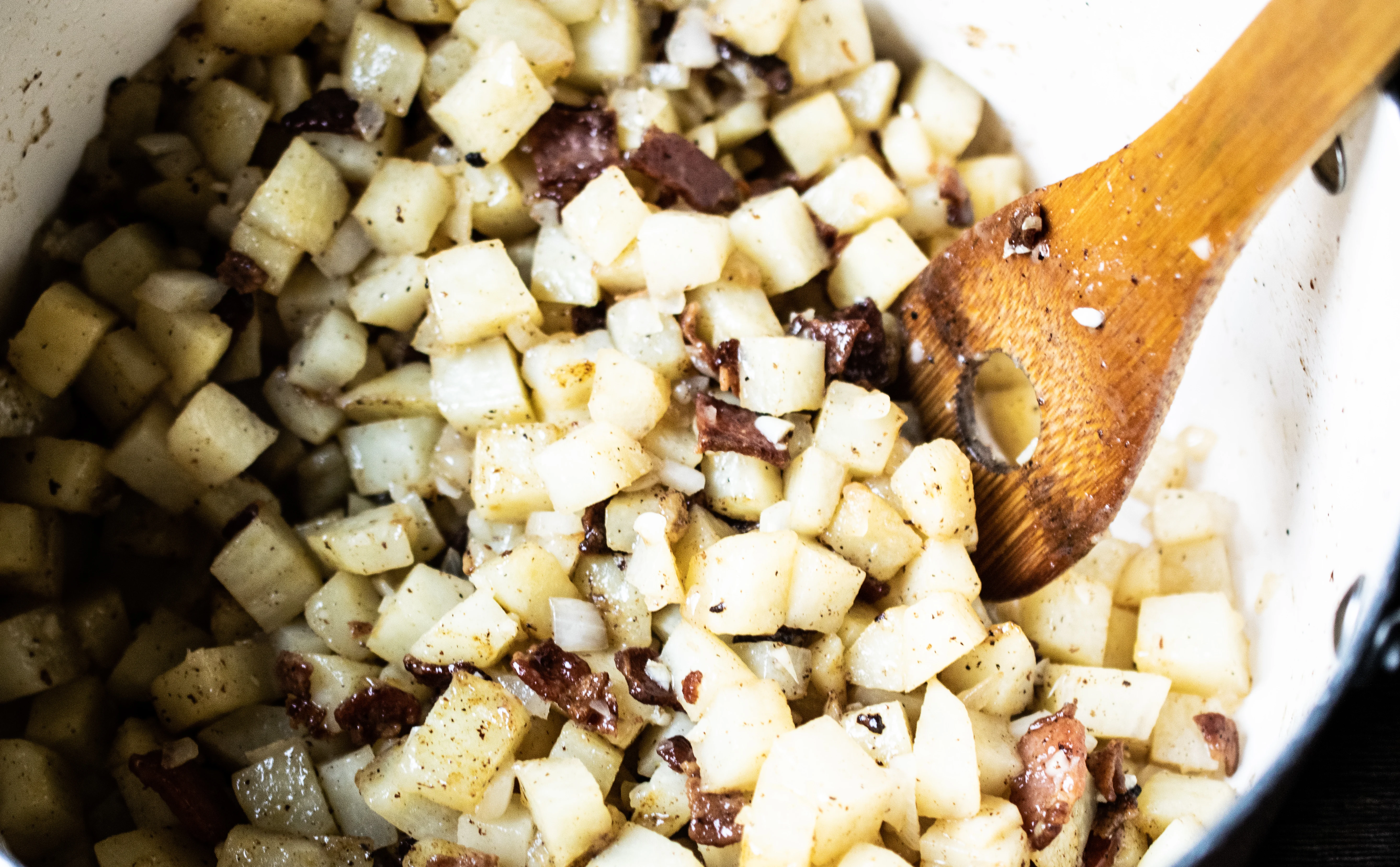 Diced potatoes and onion in a large pot.