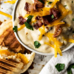 Creamy potato soup with beer and bacon in a bowl.