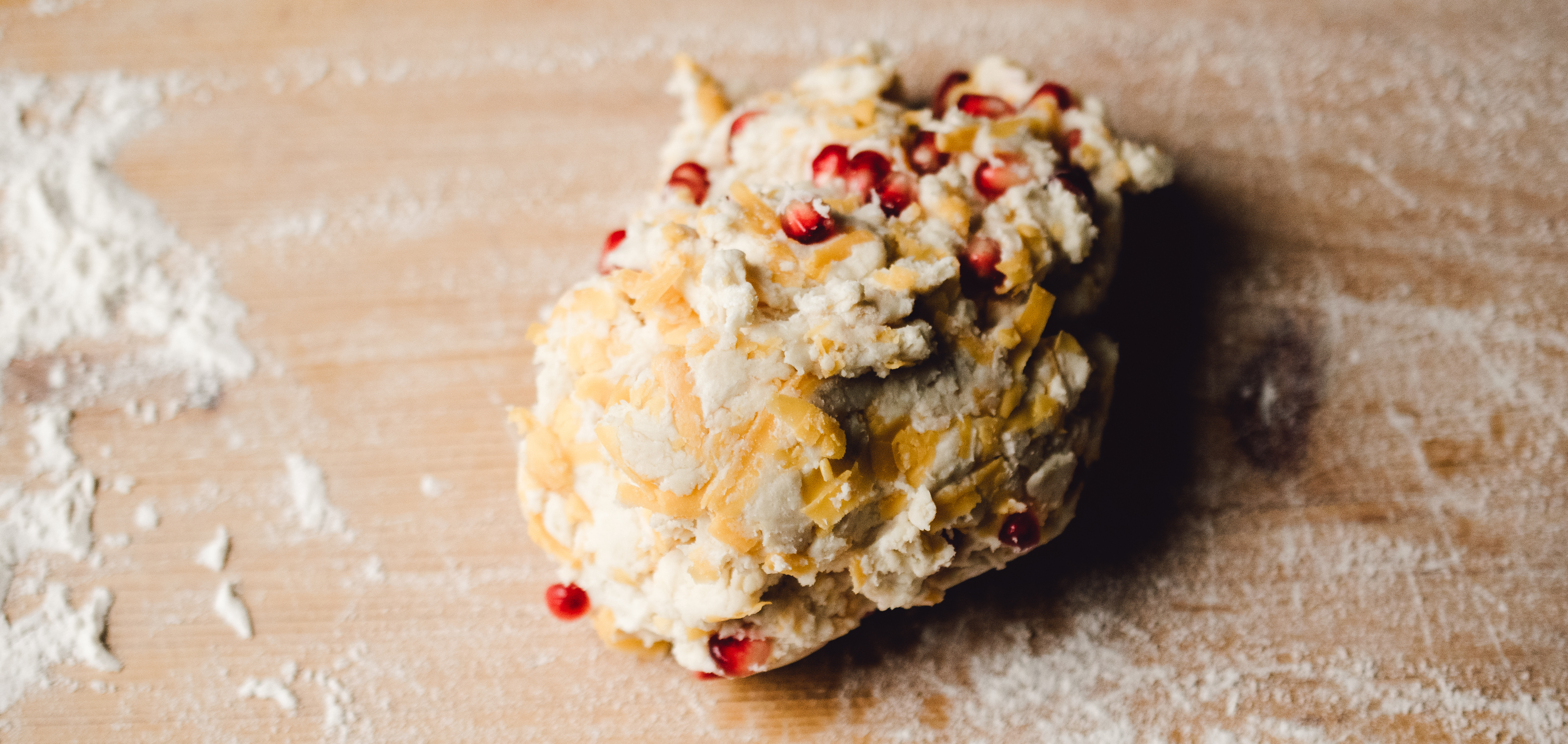 Cheddar pomegranate biscuit dough.