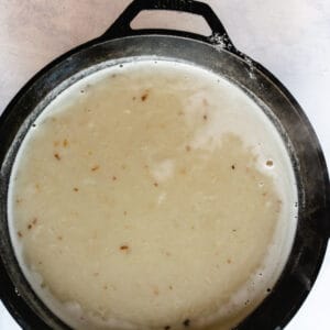 cast iron skillet with thick chicken soup sauce
