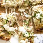chicken ranch pizza topped with zucchini and dill