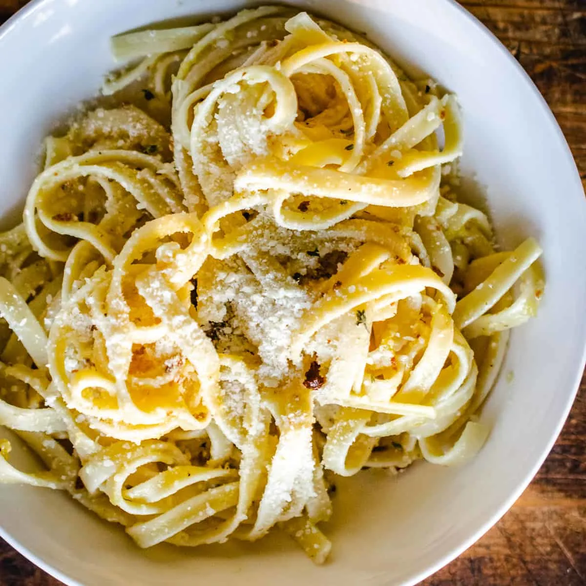 Acorn squash pasta with sausage in a bowl.