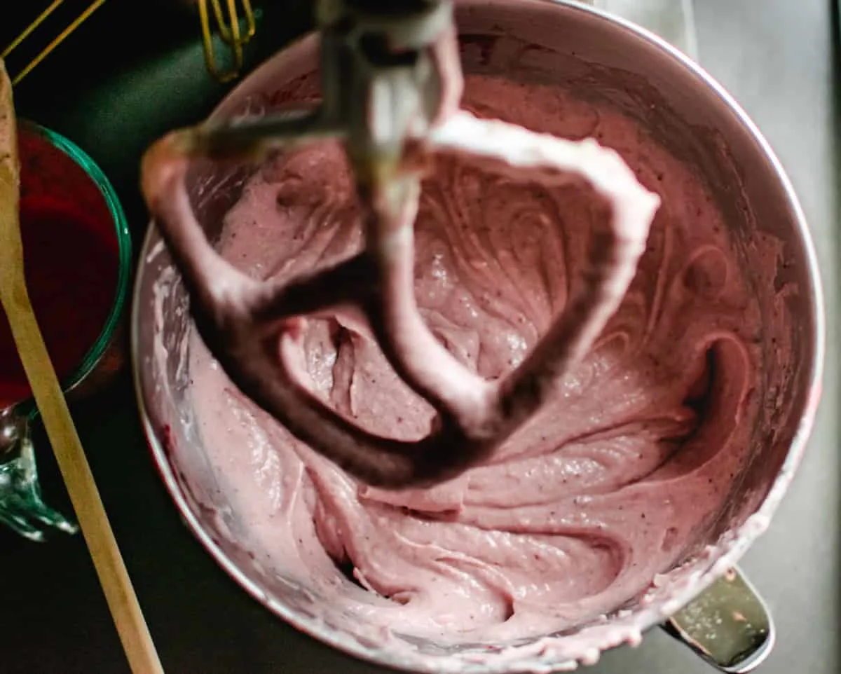 mixing bowl of pink strawberry cake batter