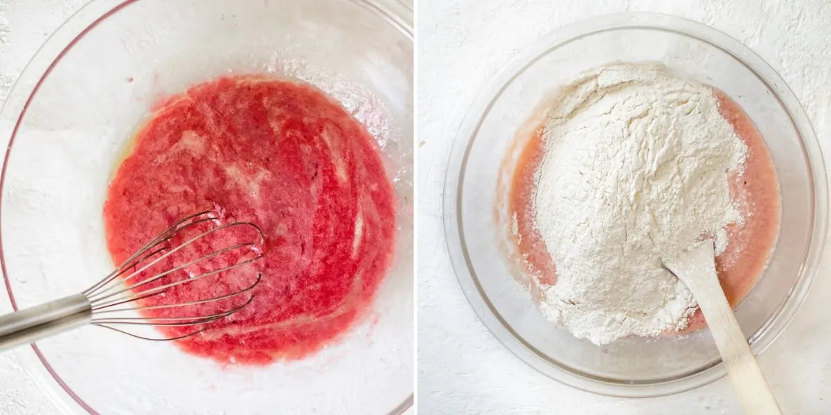 Folding flour and raspberry puree with cupcake ingredients in a bowl.
