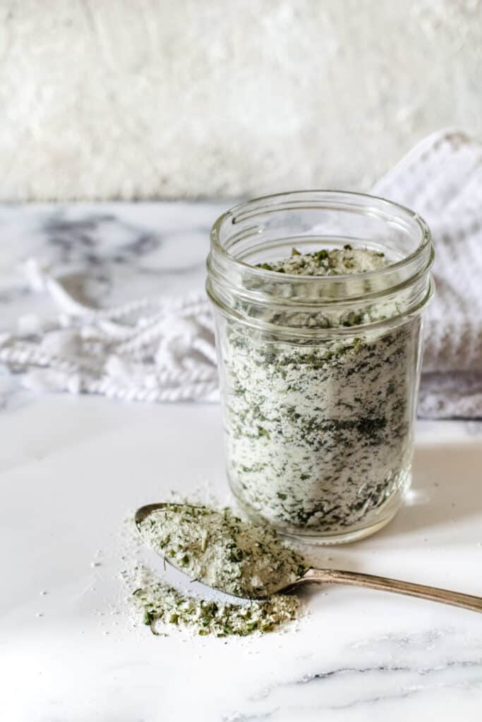 glass jar filled with homemade dry ranch seasoning mix