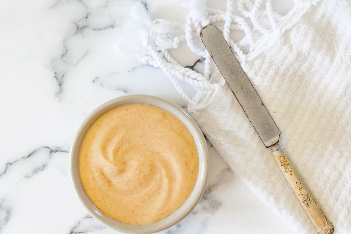 Seasoned mayonnaise in a ramekin.