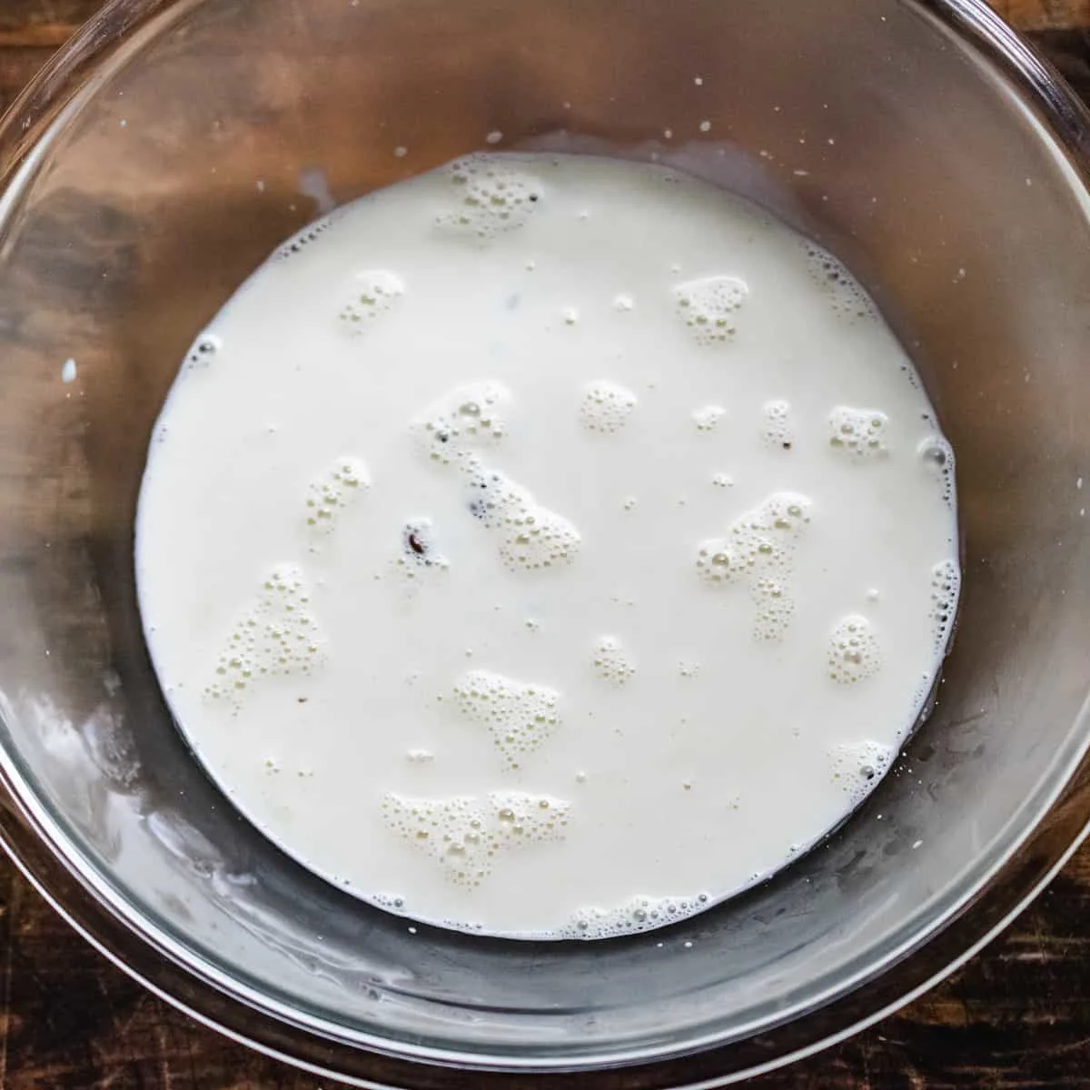 Chocolate chips and heavy cream in a bowl. 