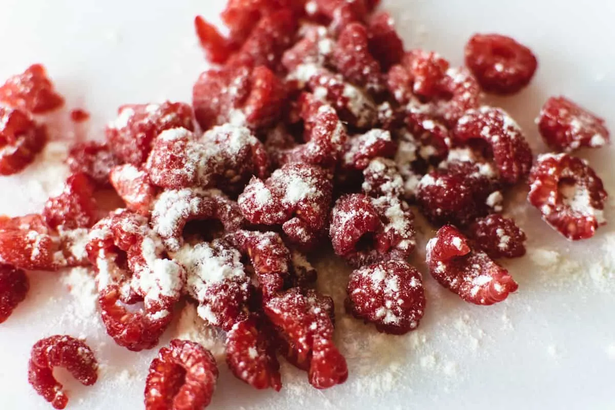 roughly chopped raspberries dusted lightly with flour