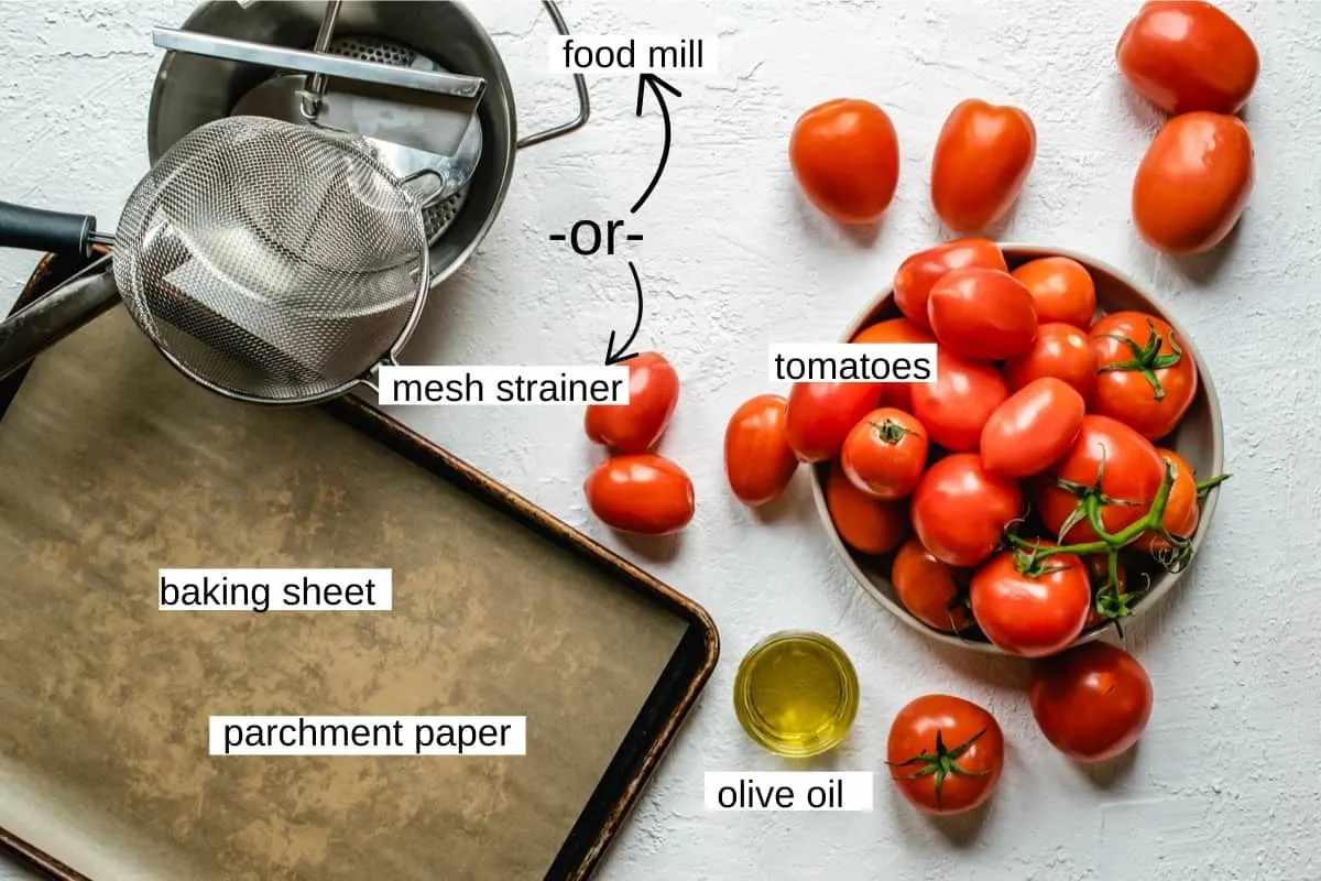 Tomatoes, food mill, baking sheet and olive oil.