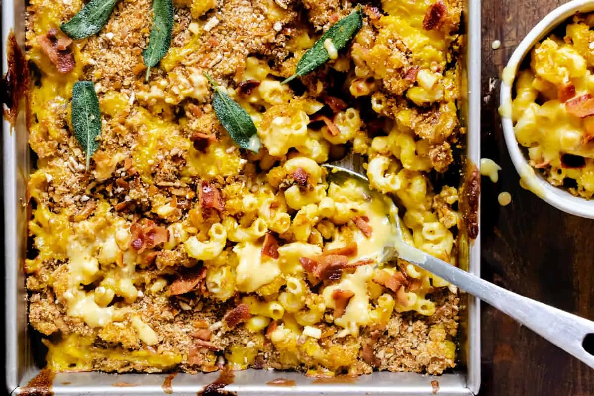Casserole dish with macaroni, cheese, bacon and herbs.