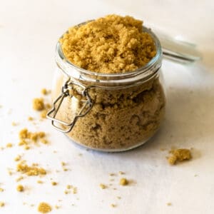 glass jar with brown sugar on gray counter top