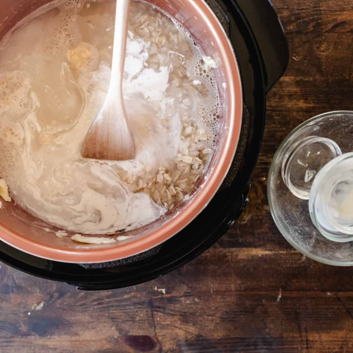 Rolled oats, cream butter and water in a pressure cooker.