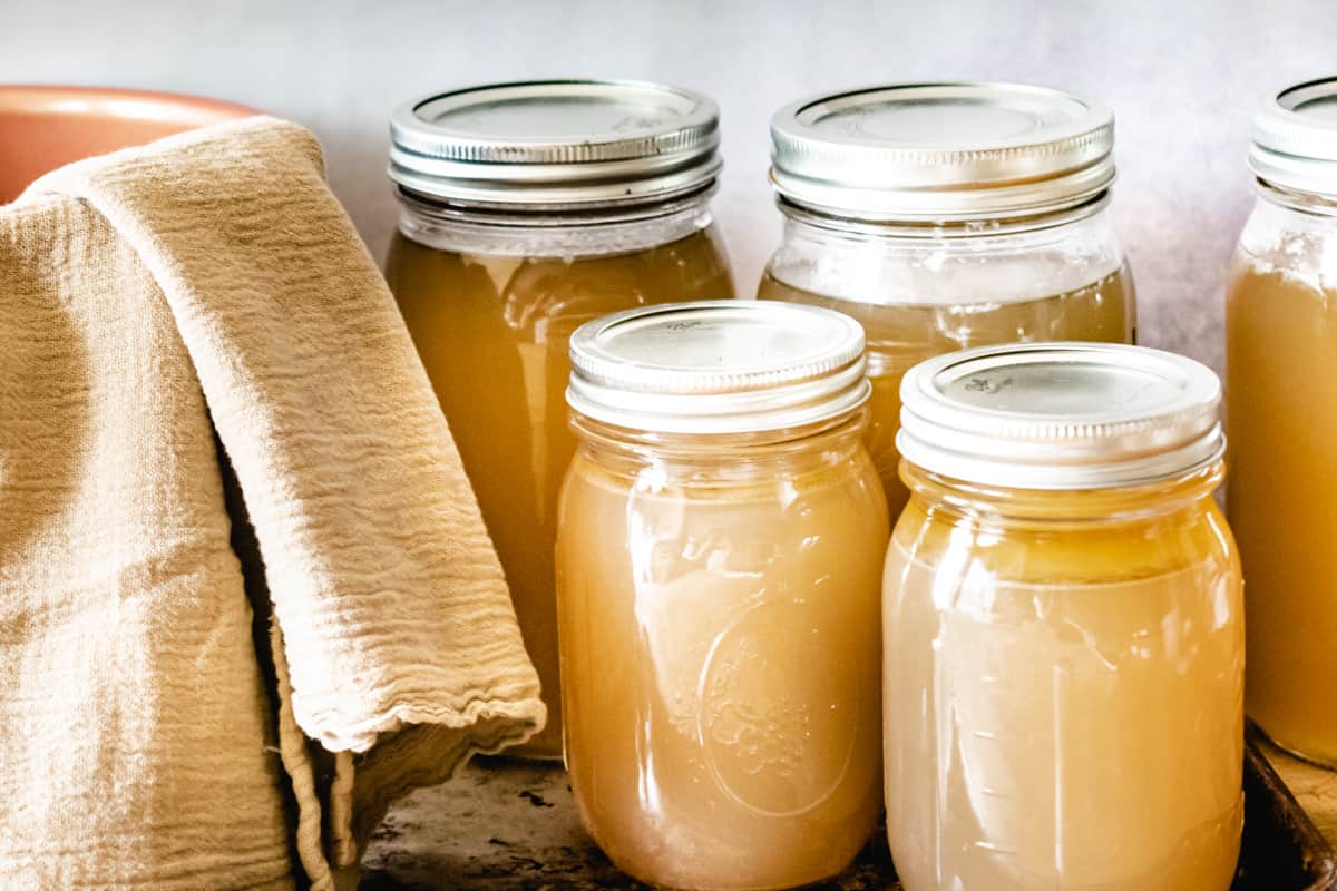 Mason jars with canned chicken and beef stock