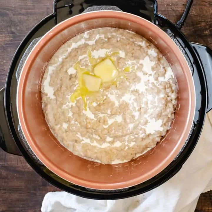 A pressure cooker of cooked oatmeal.