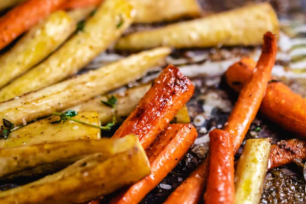Peeled, roasted carrots and parsnips in a honey butter and herb glaze.
