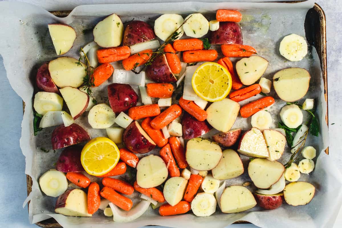 Cut root vegetables on a baking sheet.