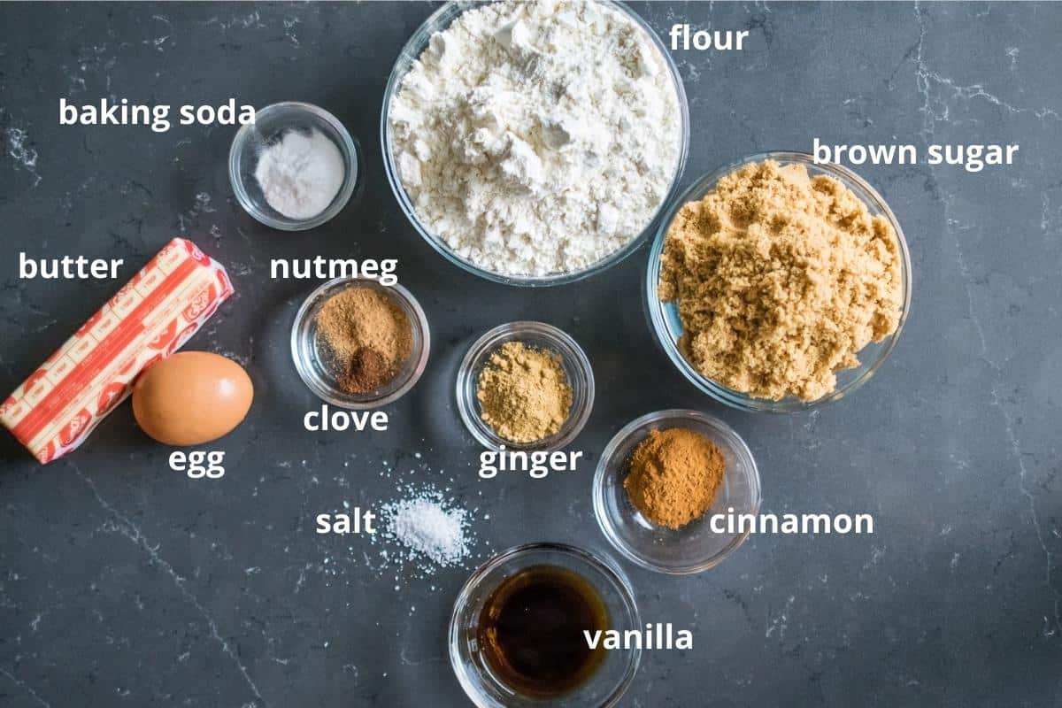 Ingredients for making gingerbread cookies on a counter top.
