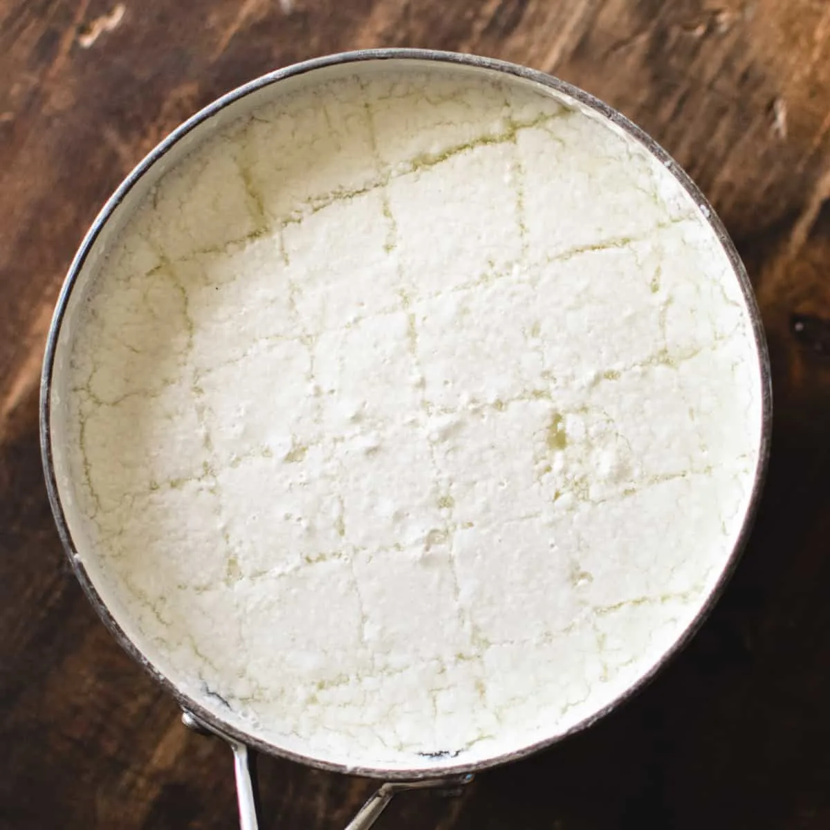 Coagulated milk to make homemade mozzarella cheese.