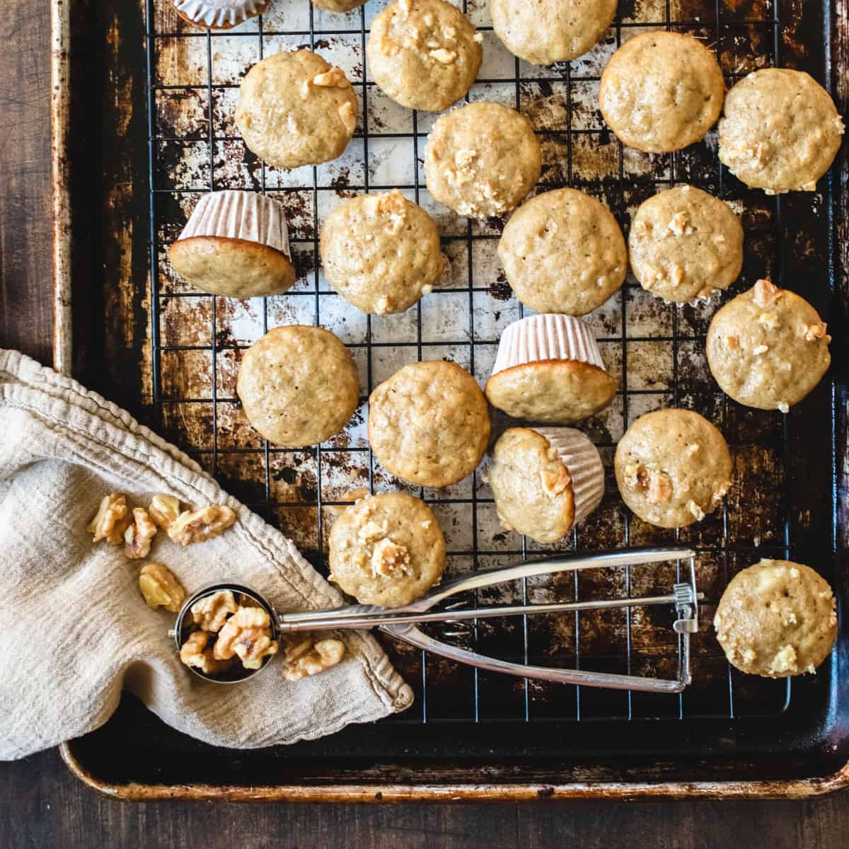 Mini banana muffins on a cooling rack.