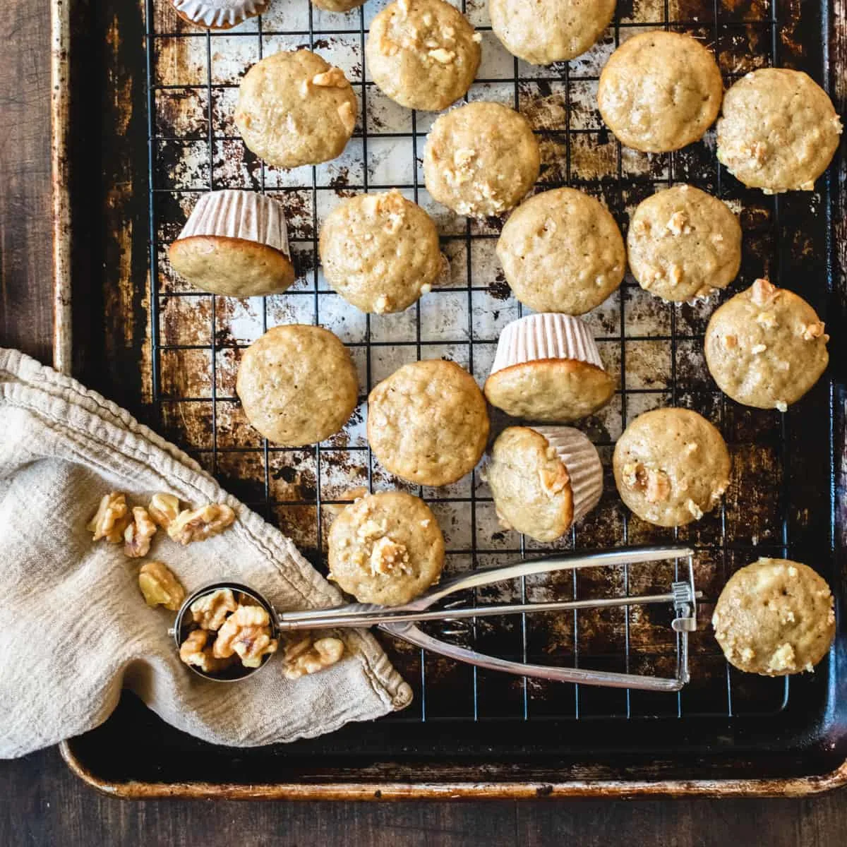 Miniature banana muffins on a cooling rack.