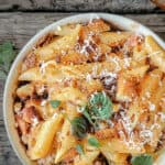Penne pasta in vodka sauce with cheese and sausage.