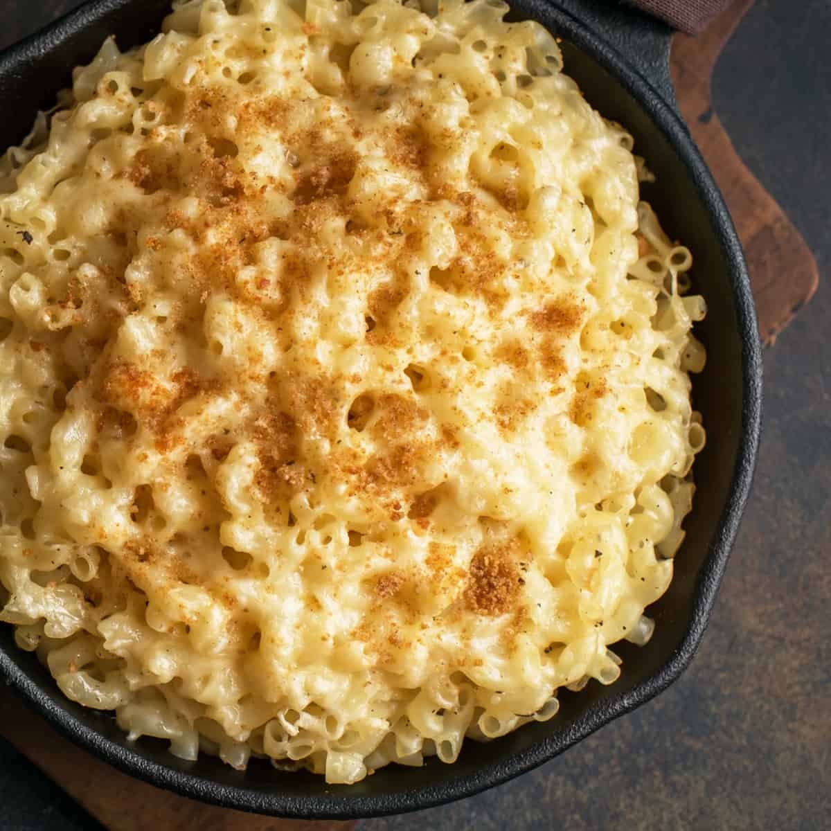 Skillet of macaroni in a smooth cheese sauce.