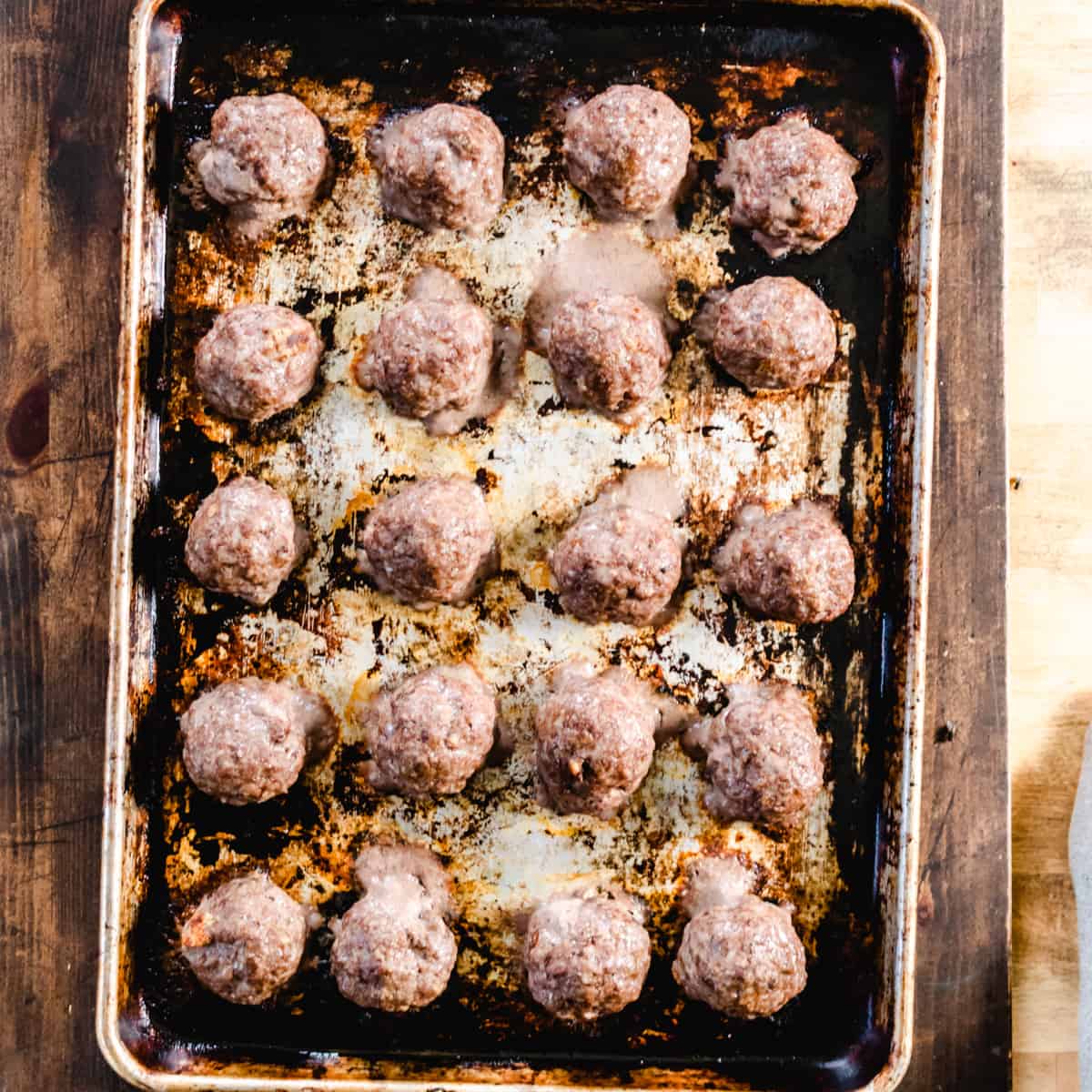 Meatballs on a baking sheet.
