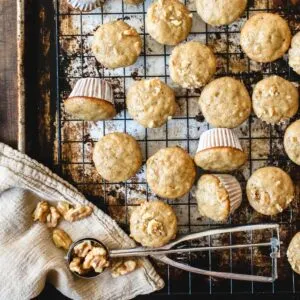 Mini banana muffins on a baking rack.