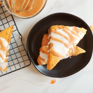 A black plate with two Pumpkin Scones.