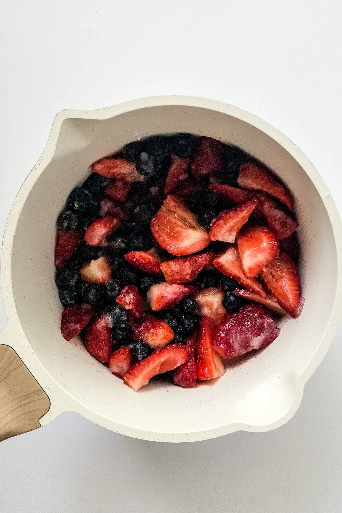 Some mixed berries and sugar cooking.