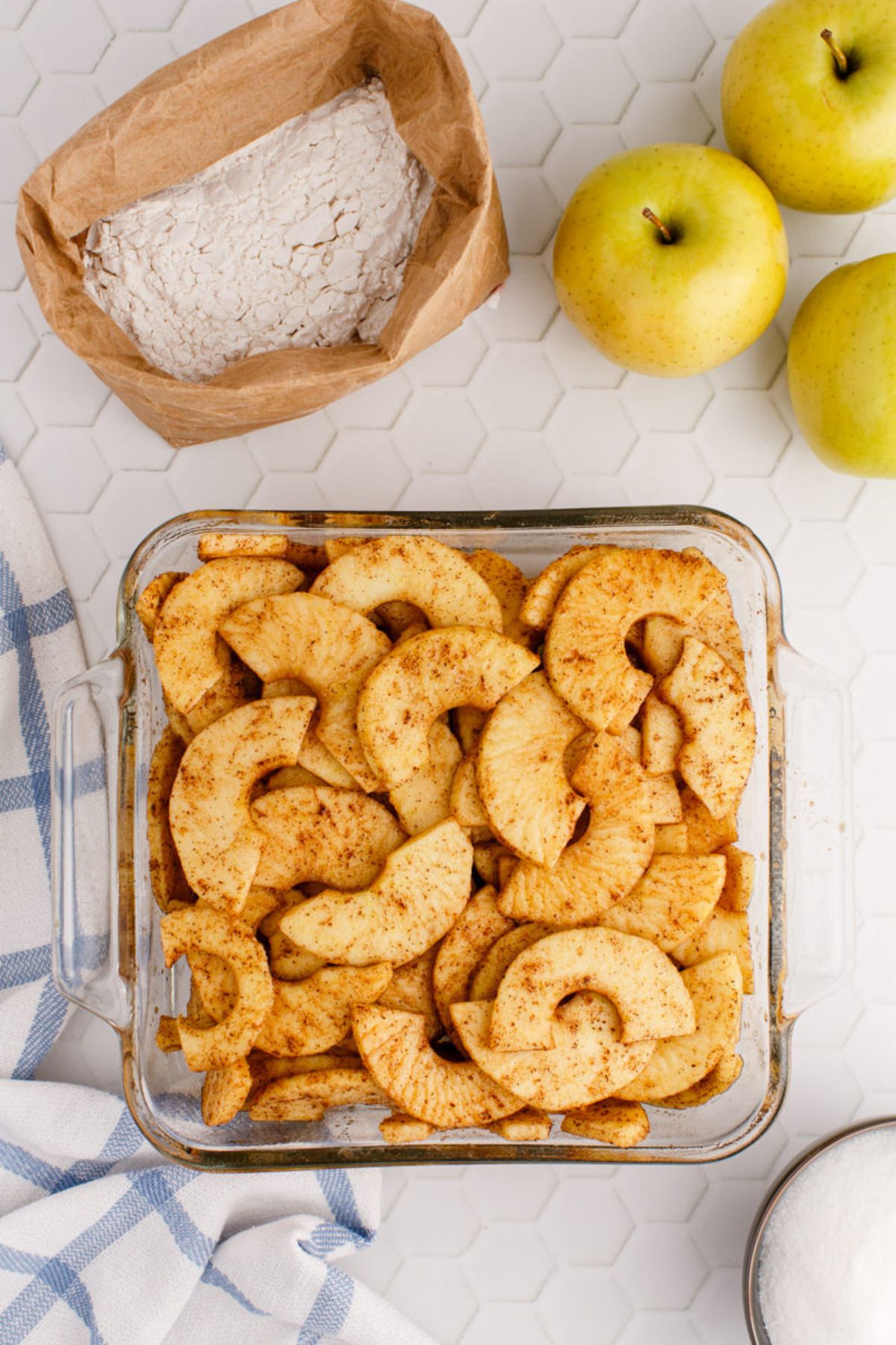 Spiced apples in a baking dish.