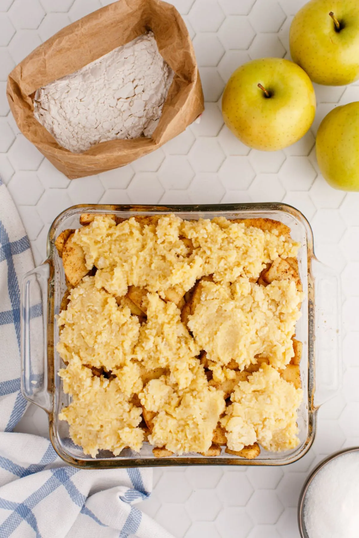 A baked apple cobbler in a baking dish.