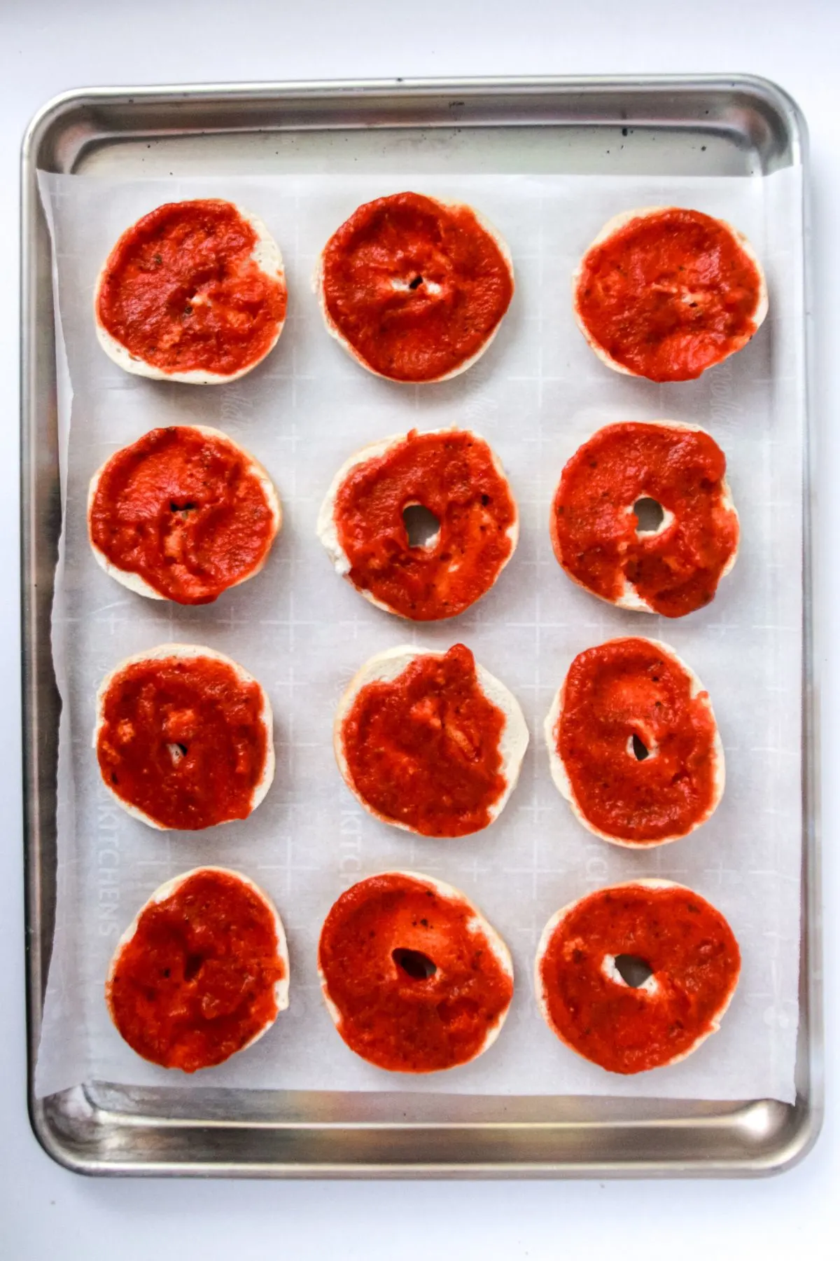 Mini bagels with pizza sauce. 